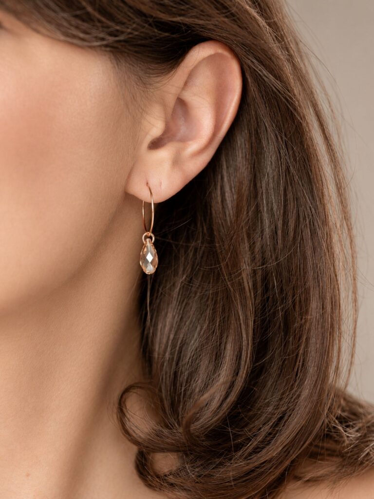 Everyday earrings with a comfortable hoop clasp and a gold crystal drop – “maniii”