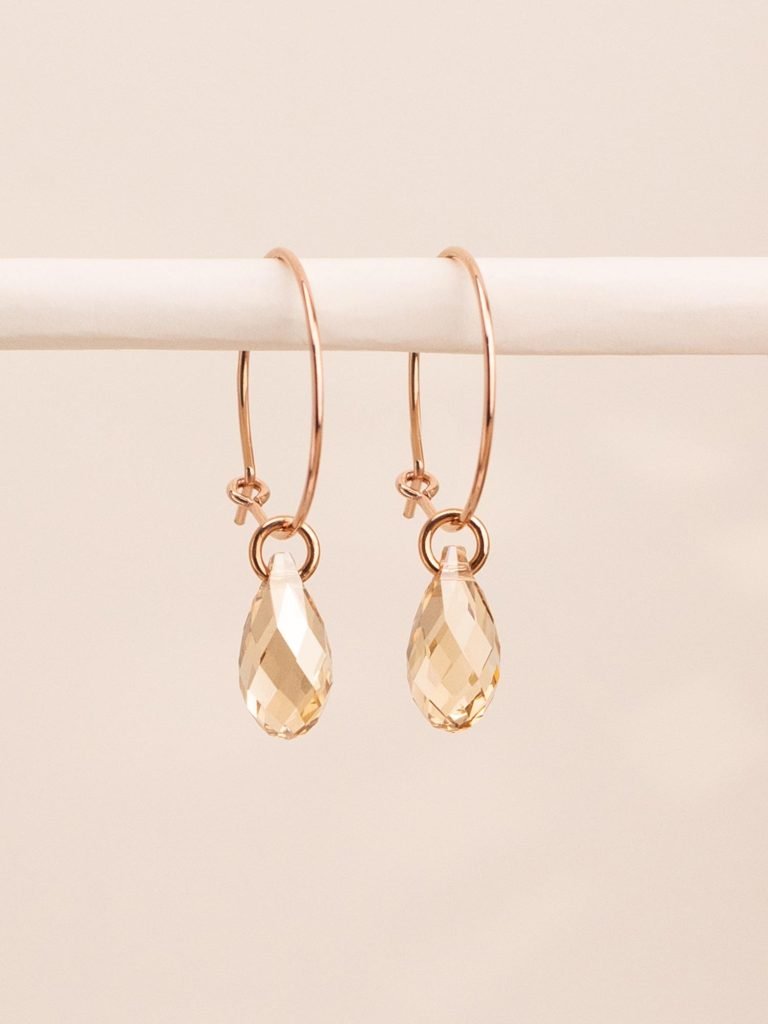 Everyday earrings with a comfortable hoop clasp and a gold crystal drop – “maniii”